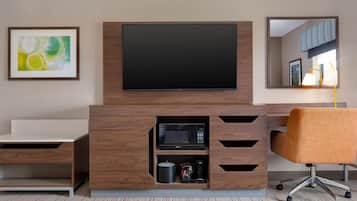 Premium bedding, desk, laptop workspace, blackout drapes