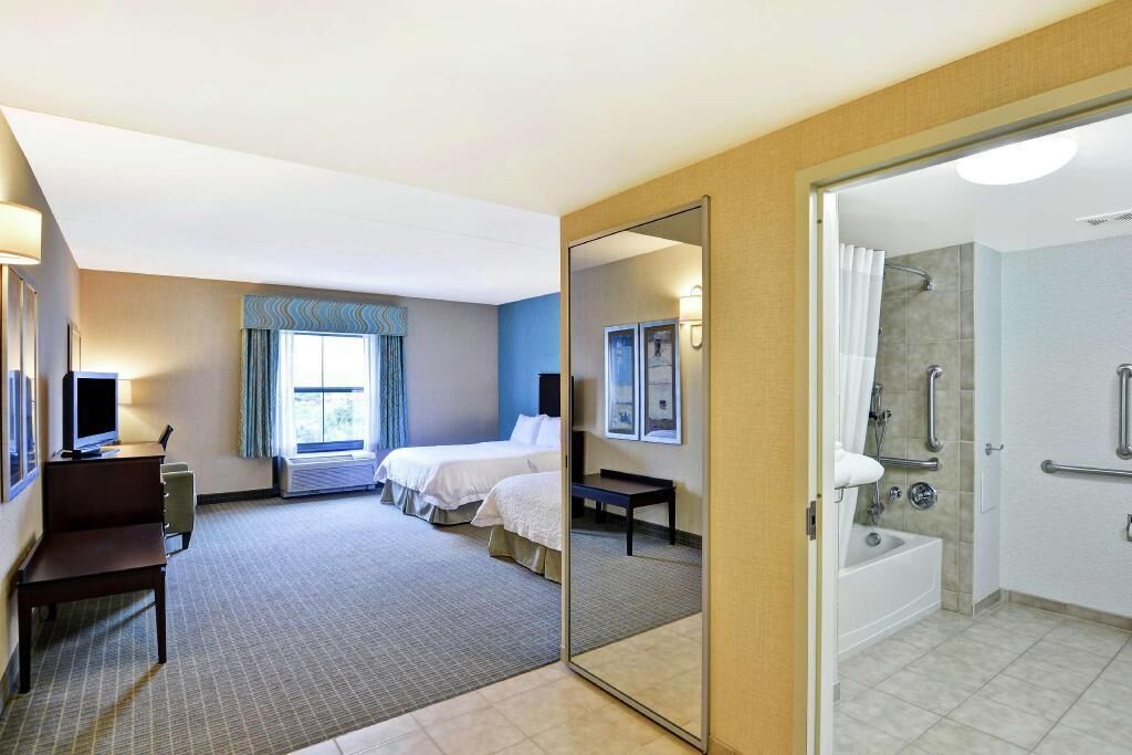 Premium bedding, desk, laptop workspace, blackout curtains