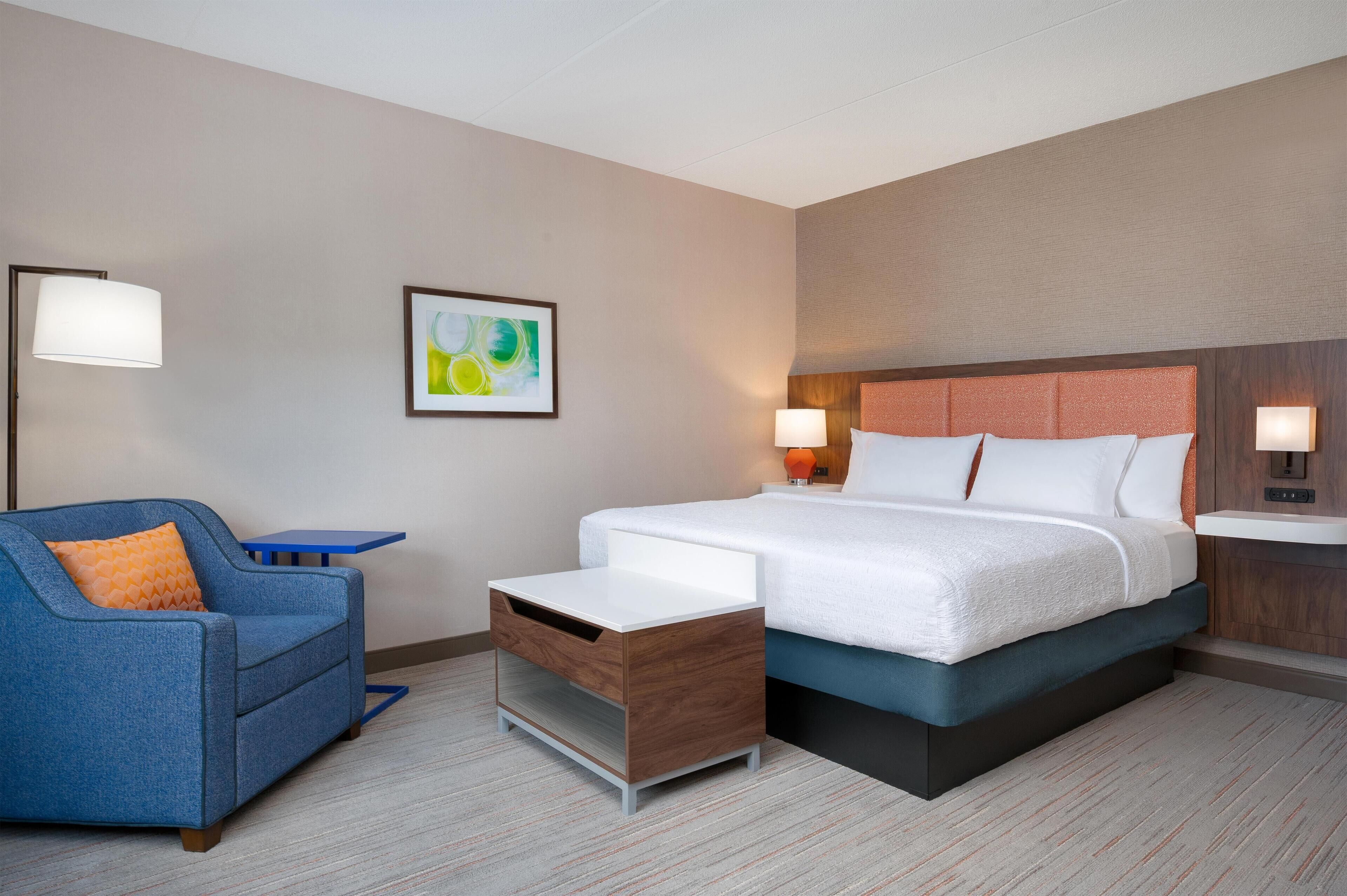 king bed | premium bedding, desk, laptop workspace, blackout curtains