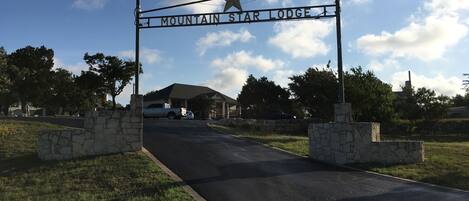A road leading to Mountain Star Lodge with a star sign above the entrance.