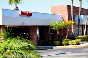 Welcome to STAYIN', where a charming entrance invites you in.