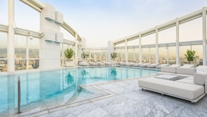 Seasonal outdoor pool, open 7 AM to 6:00 PM, pool loungers