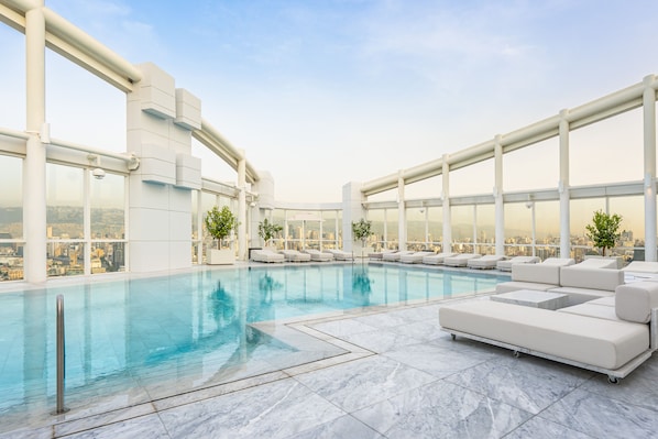 Seasonal outdoor pool, open 7 AM to 6:00 PM, pool loungers