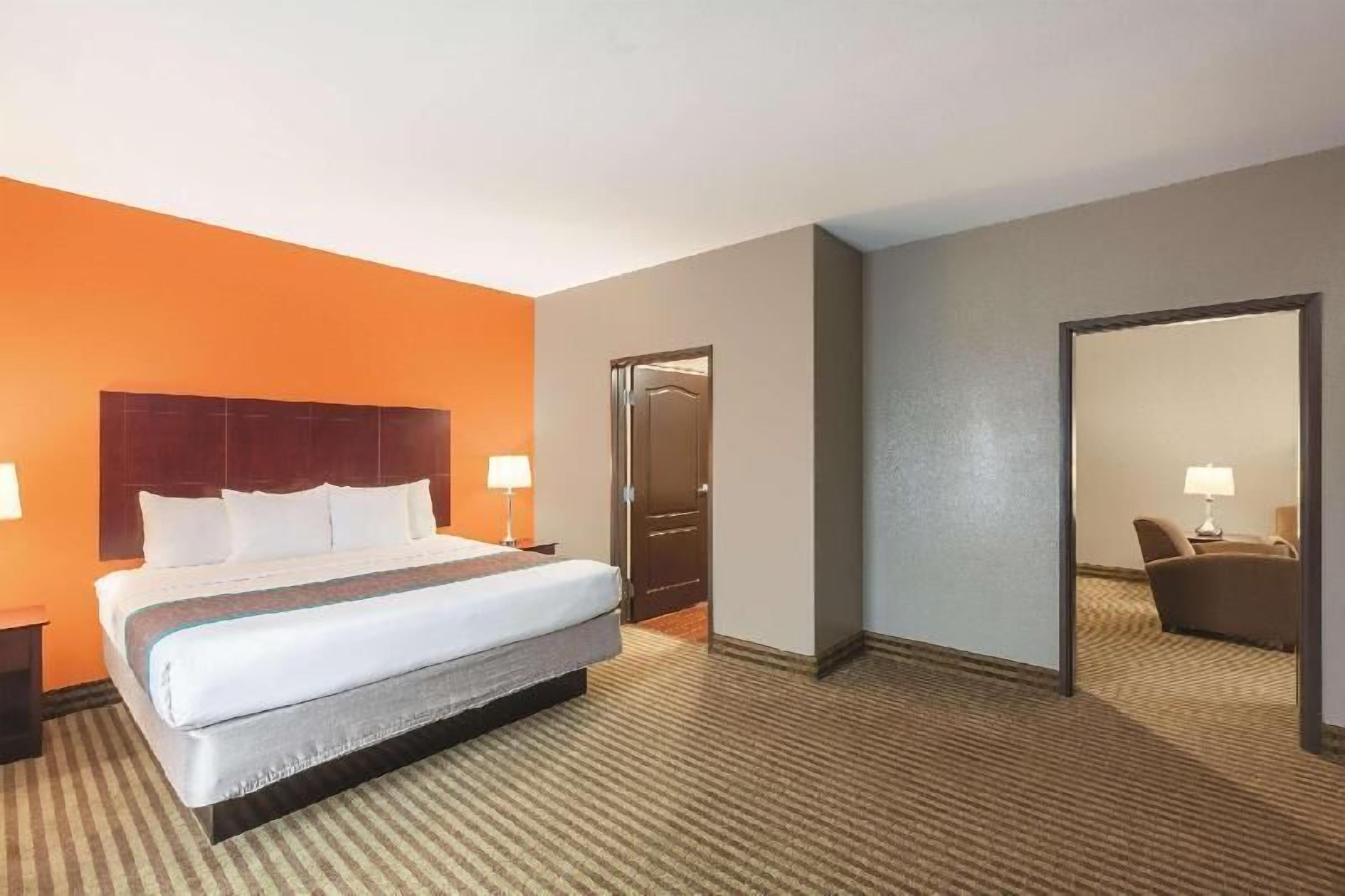 Premium bedding, desk, laptop workspace, iron/ironing board