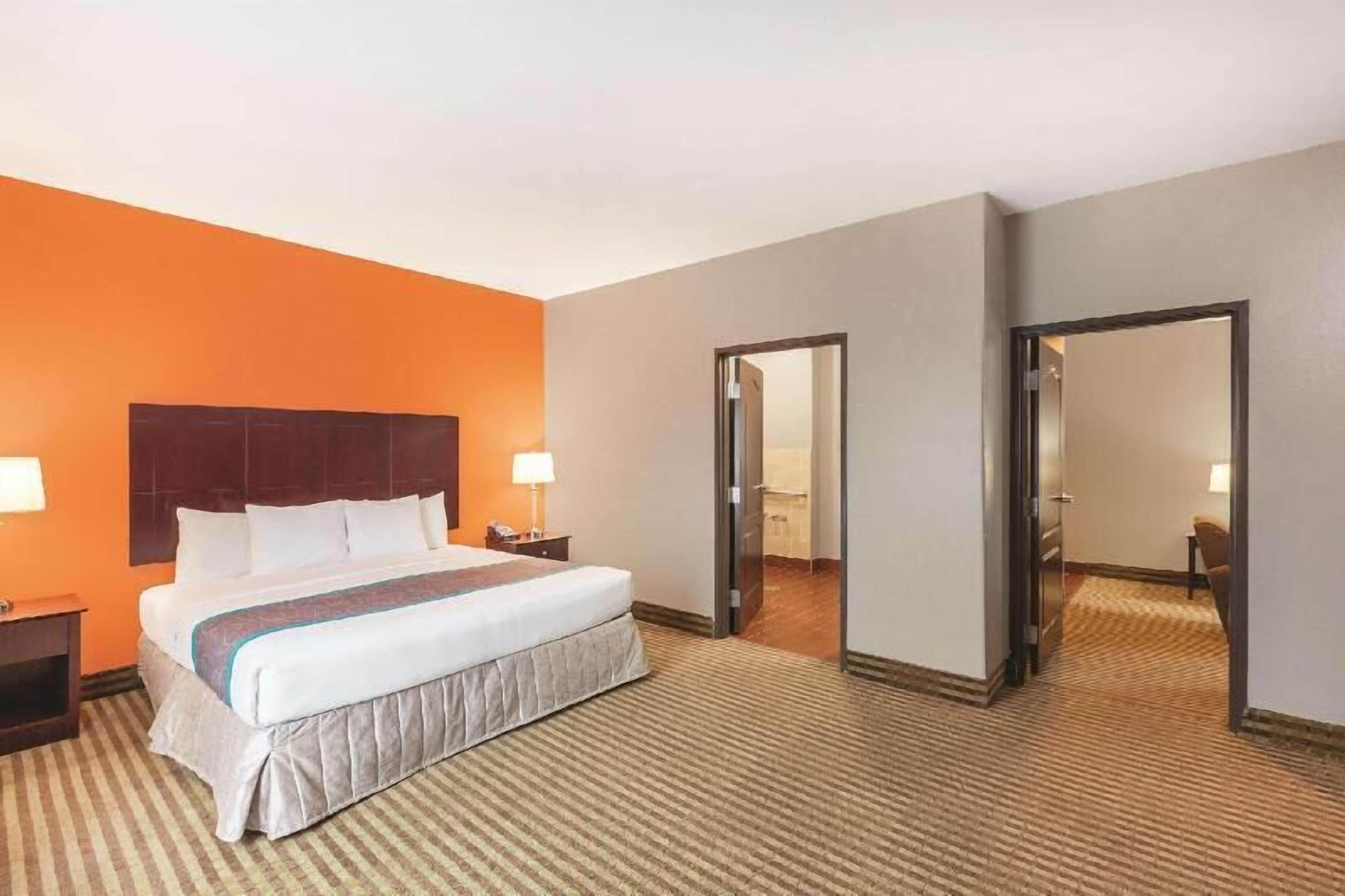 Premium bedding, desk, laptop workspace, iron/ironing board