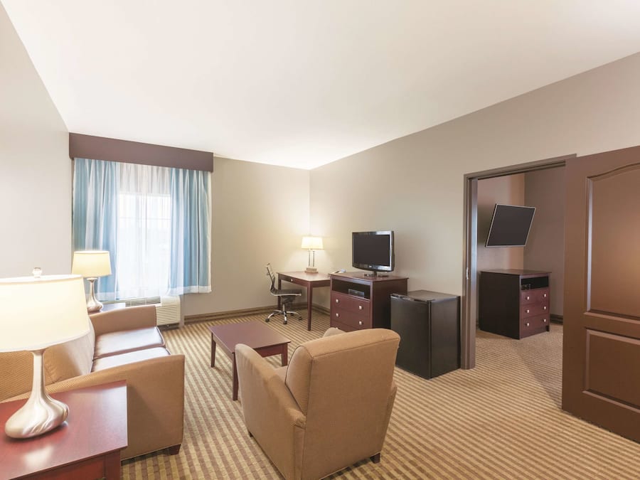 Premium bedding, desk, laptop workspace, iron/ironing board