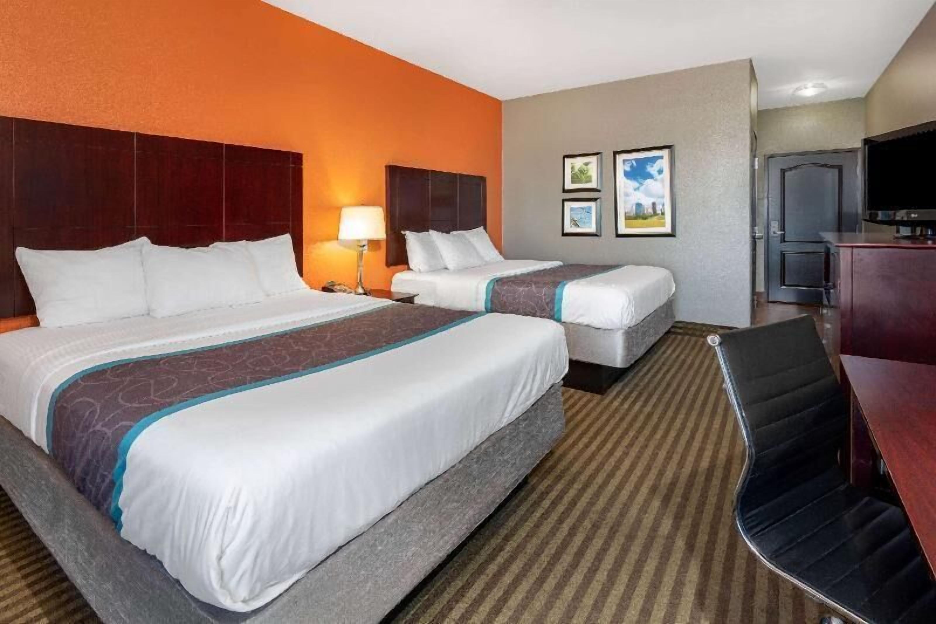 Premium bedding, desk, laptop workspace, iron/ironing board