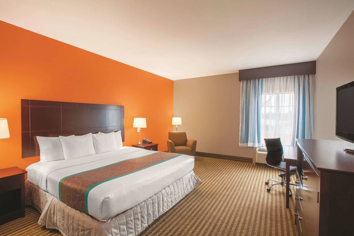 Premium bedding, desk, laptop workspace, iron/ironing board