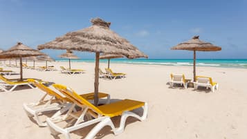 Praia particular, prática de vôlei de praia