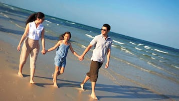 On the beach, sun-loungers, beach umbrellas, beach towels