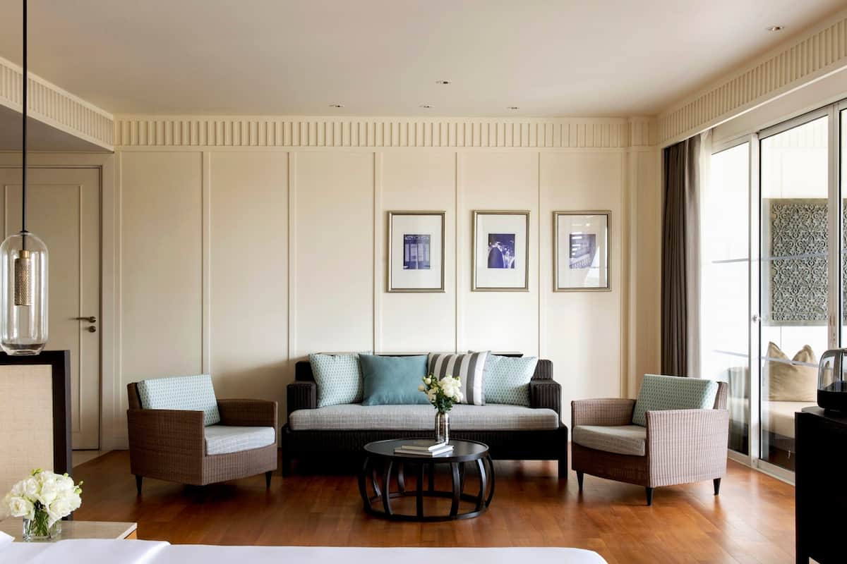 Relax in a serene space with a large bed, flat-screen TV, and beautiful views.