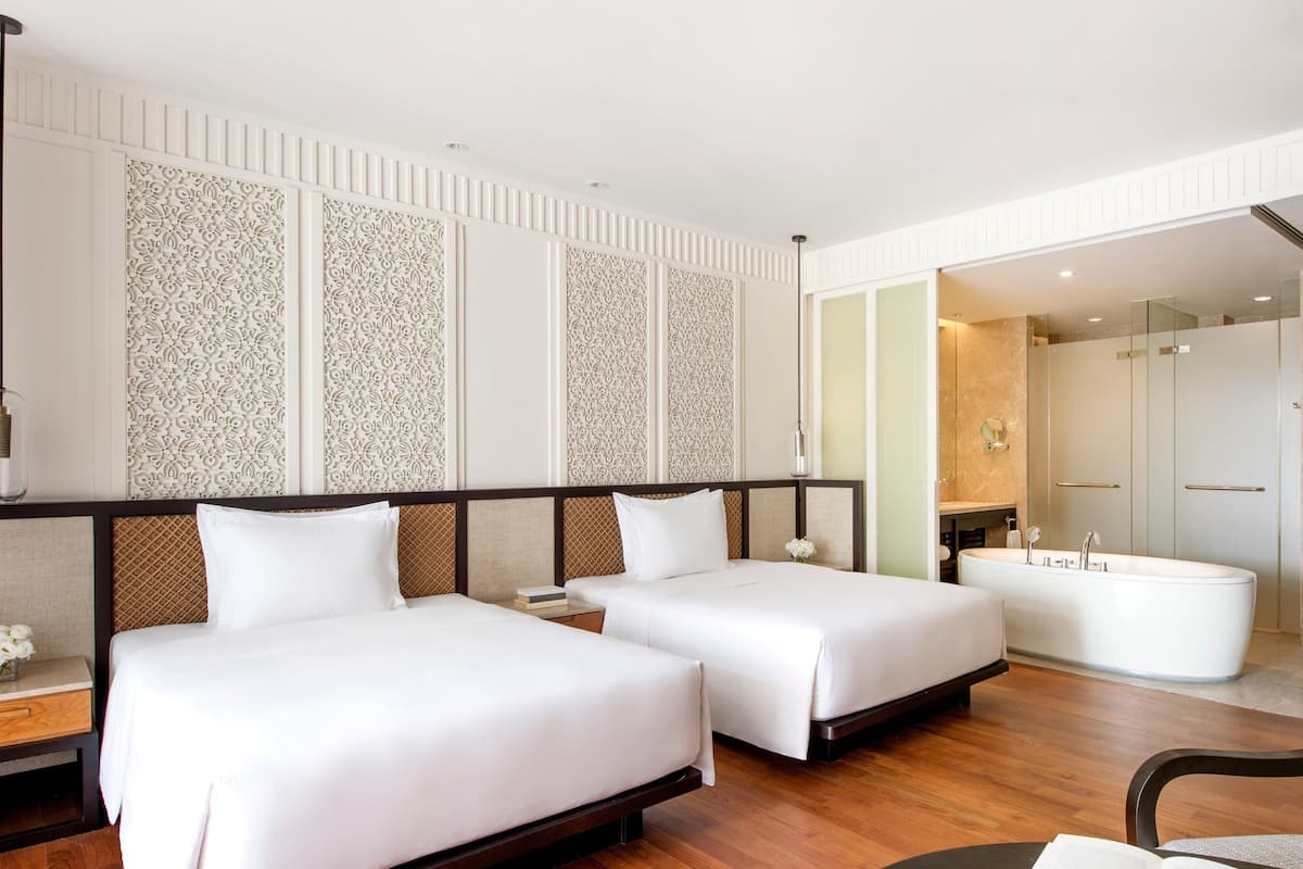 Premium bedding, down comforters, pillowtop beds, minibar