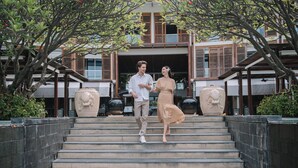 A couple walking up a set of stone steps with a building in the background. - Intercontinental Hua Hin Resort by IHG (Hua Hin)