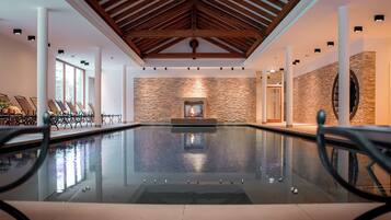 Indoor pool, open 7:00 AM to 10:00 PM, pool loungers
