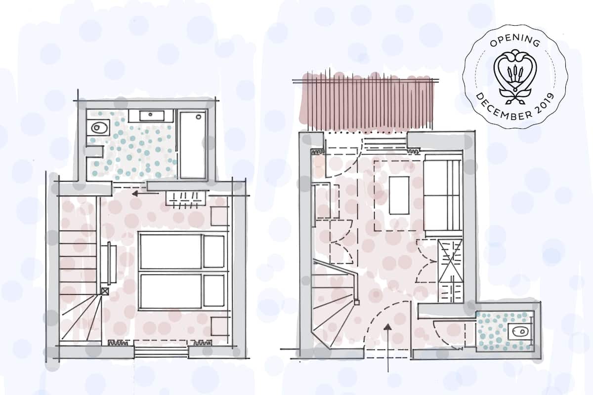 Grundriss eines Gebäudes mit Küche, Essbereich und Wohnzimmer. Eine Treppe führt zu einer oberen Ebene.