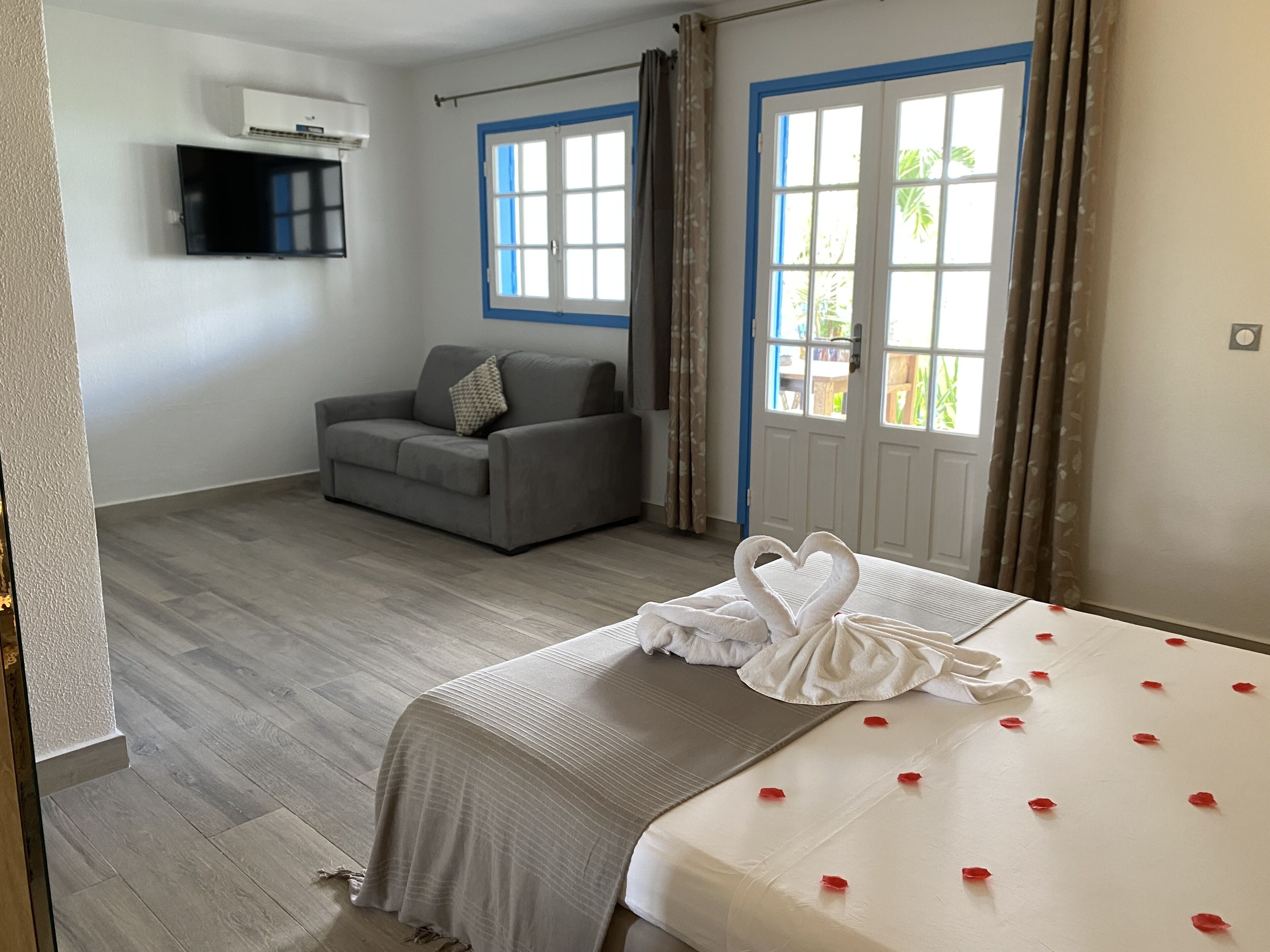 Standard Suite | Living area | 100-cm Smart TV with cable channels