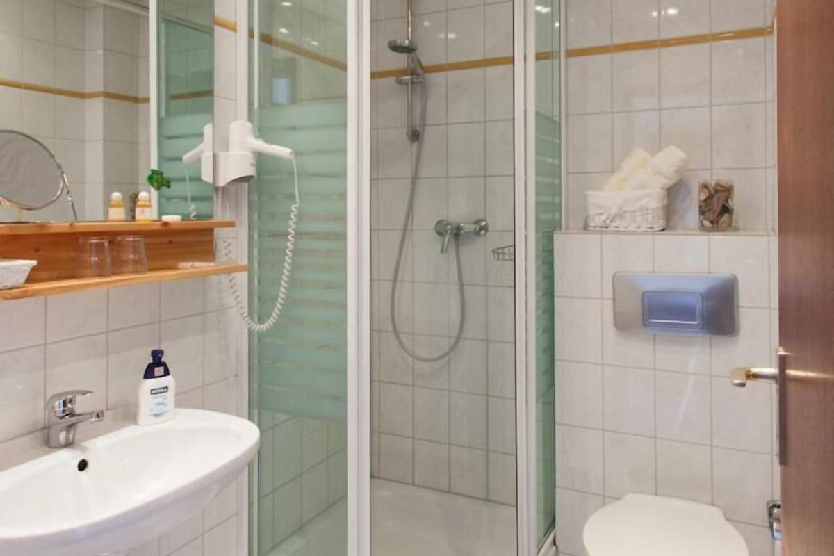 hair dryer, bathrobes, towels