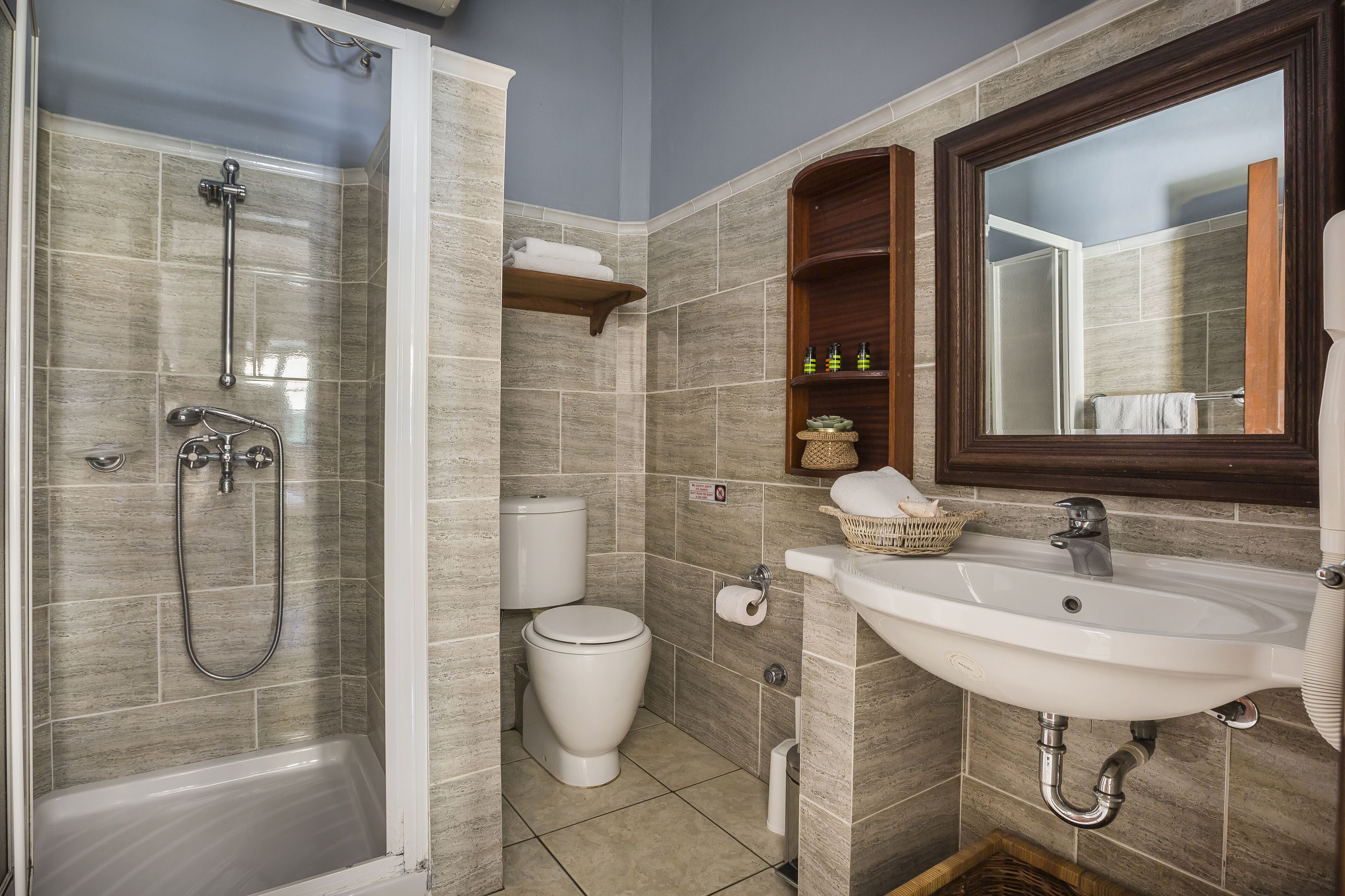 A bathroom with a bathtub, toilet, and sink.