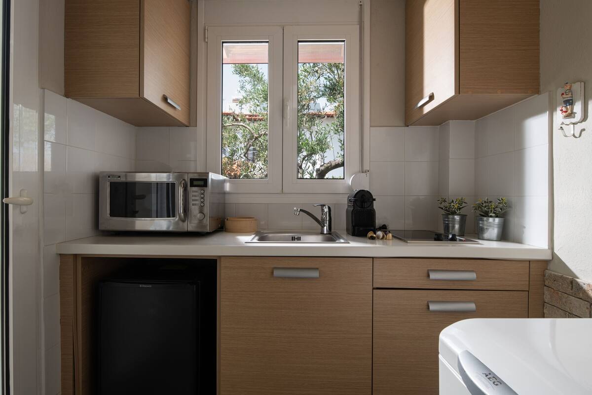 bungalow, 1 bedroom, courtyard view (outdoor jetted tub) | private kitchen | mini-fridge, espresso maker, coffee/tea maker, high chair