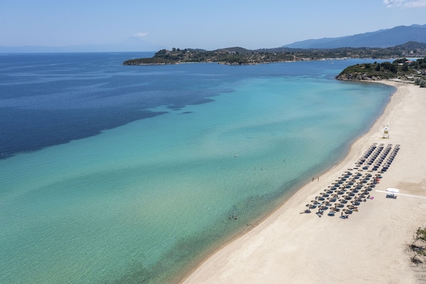 On the beach, sun loungers, beach umbrellas, beach towels