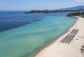 On the beach, sun loungers, beach umbrellas, beach towels