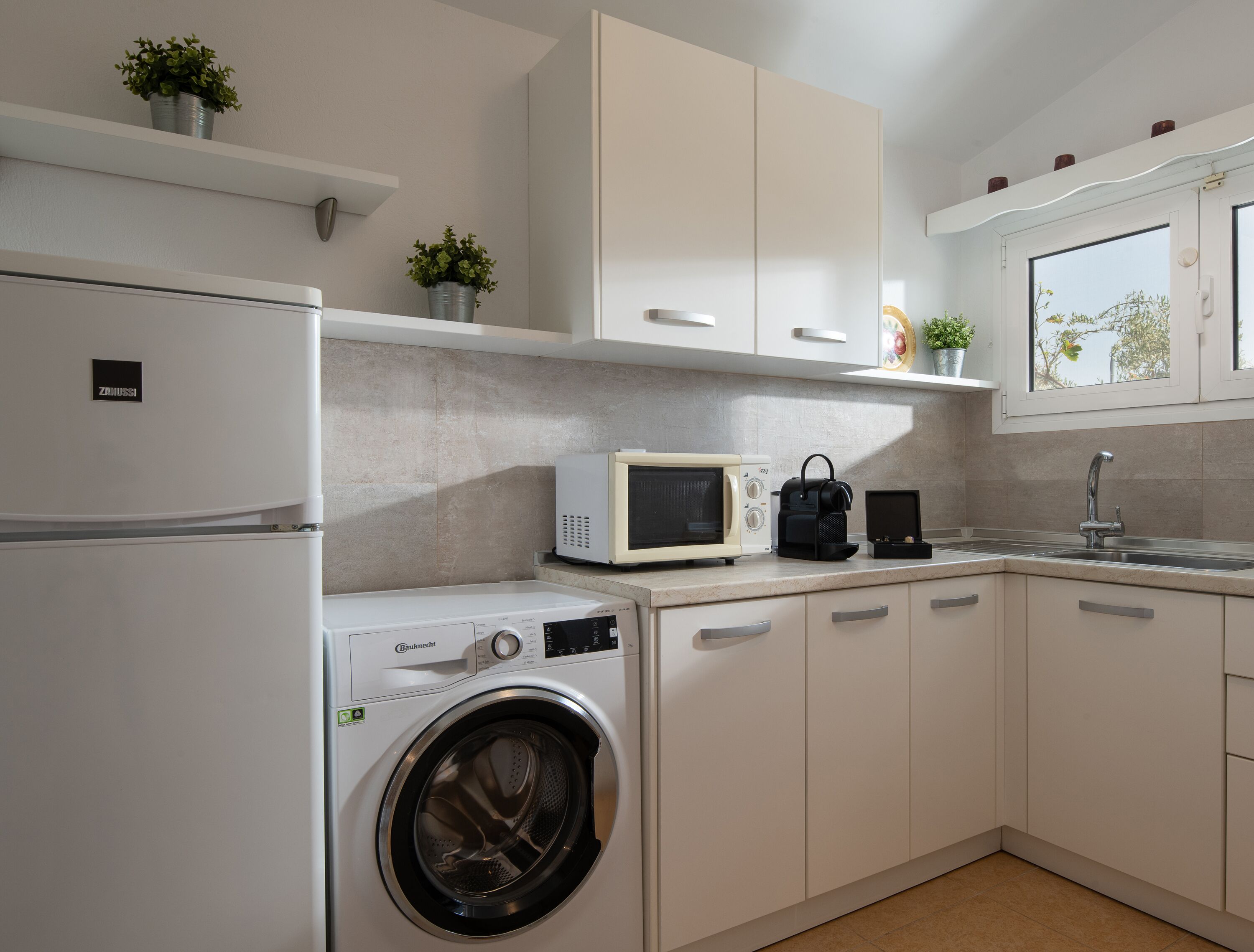 bungalow, 1 bedroom, sea view (outdoor jetted tub) | private kitchen | mini-fridge, espresso maker, coffee/tea maker, high chair