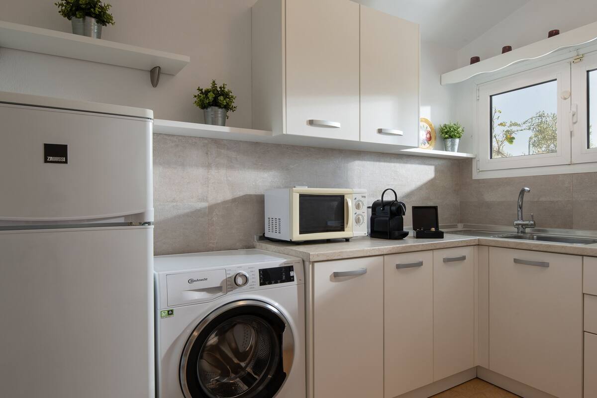 bungalow, 1 bedroom, sea view (outdoor jetted tub) | private kitchen | mini-fridge, espresso maker, coffee/tea maker, high chair