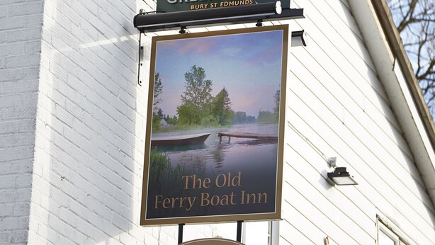 A sign for Greene King Bury St Edmunds, The Old Ferry Boat Inn, with a scenic river view. - Old Ferry Boat St Ives by Greene King Inns (St Ives)