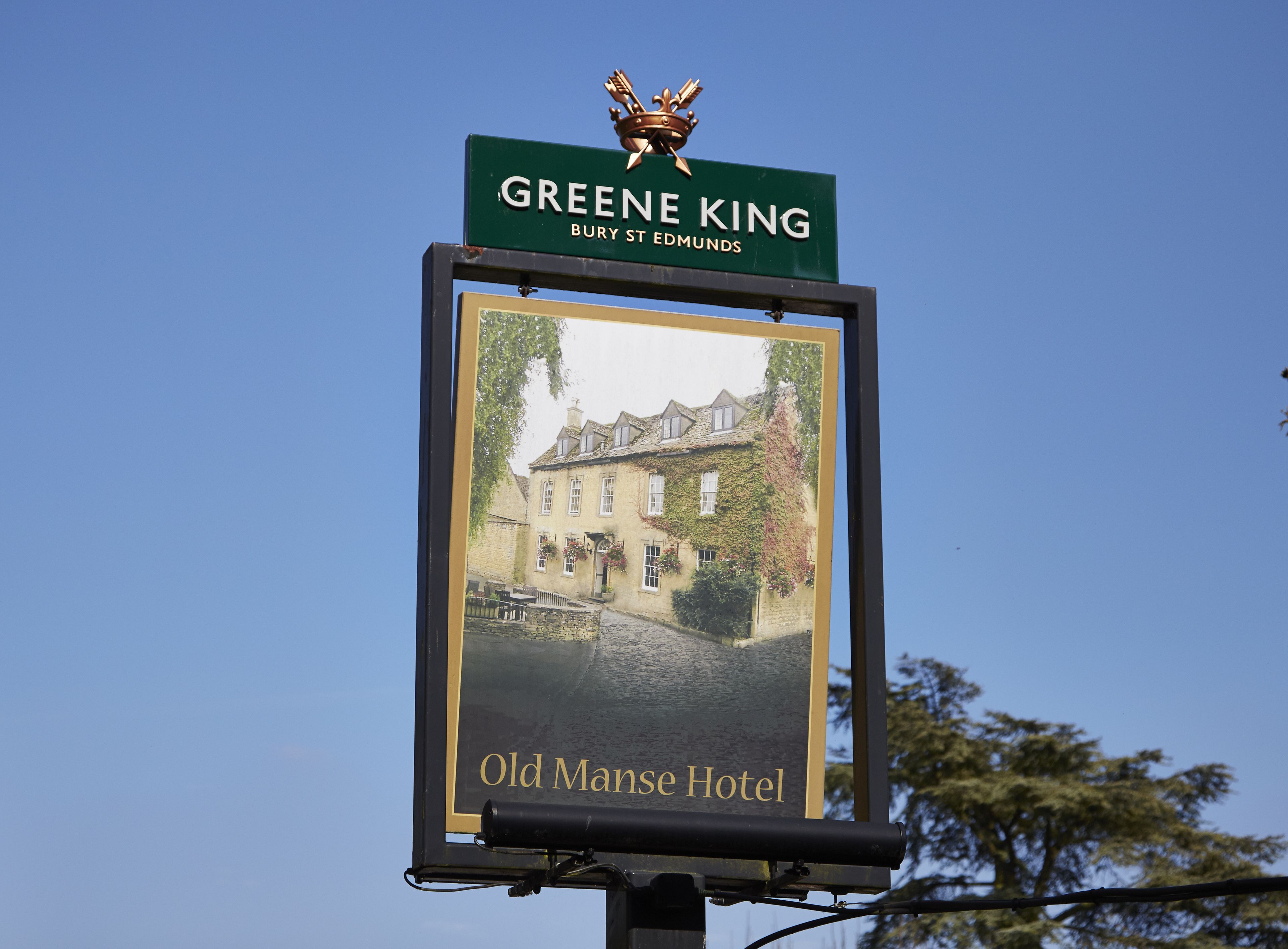 A sign for the Greene King Bury St Edmunds Old Mans Hotel.