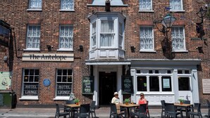 A brick building with a sign reading "The Antelope" and a corner window. - Antelope Hotel by Greene King Inns (Poole)