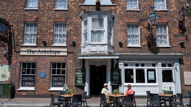 A brick building with a sign reading "The Antelope" and a corner window. - Antelope Hotel by Greene King Inns (Poole)