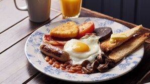 A plate of breakfast food including toast, eggs, sausages, and beans. - Antelope Hotel by Greene King Inns (Poole)