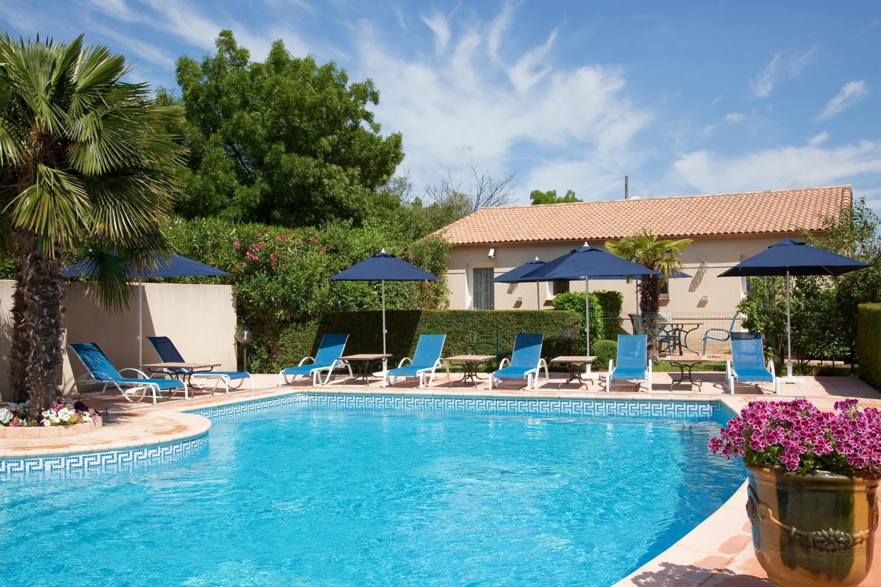 Outdoor pool, open 9:00 AM to 10:00 PM, sun loungers