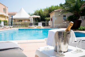Outdoor pool, open 9:00 AM to 10:00 PM, sun loungers