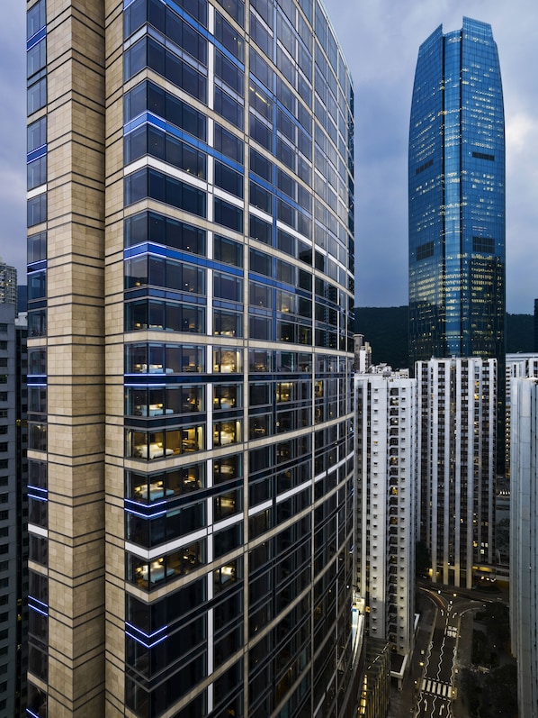 A high-rise building with a curved facade, large windows, and a modern architectural design.