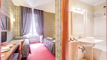 Standard Triple Room, 1 Bedroom, Private Bathroom, City View | Premium bedding, minibar, in-room safe, individually decorated