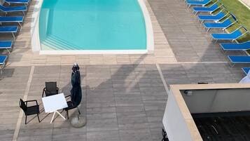 Seasonal outdoor pool, open 8:00 AM to 6:30 PM, sun loungers