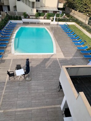 Seasonal outdoor pool, open 8:00 AM to 6:30 PM, pool loungers