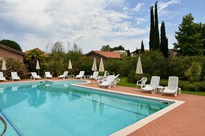 Outdoor pool, open 10:00 AM to 7:00 PM, pool umbrellas, sun loungers