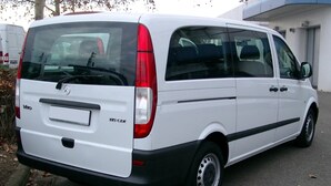 A white van parked in front of a building. - Nautilus Apartments (Agios Nikolaos)