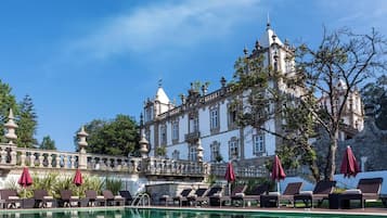 Indoor pool, outdoor pool, pool umbrellas, pool loungers