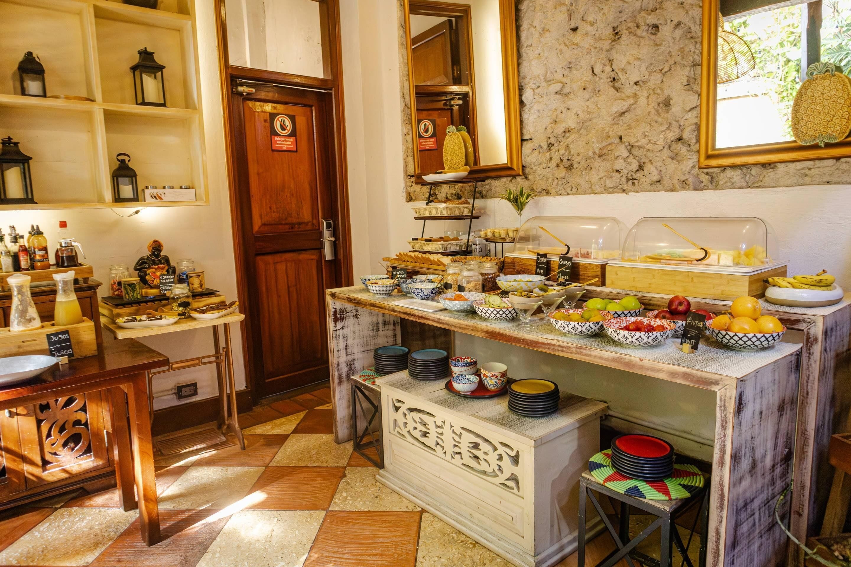 A breakfast buffet with various food items and beverages.