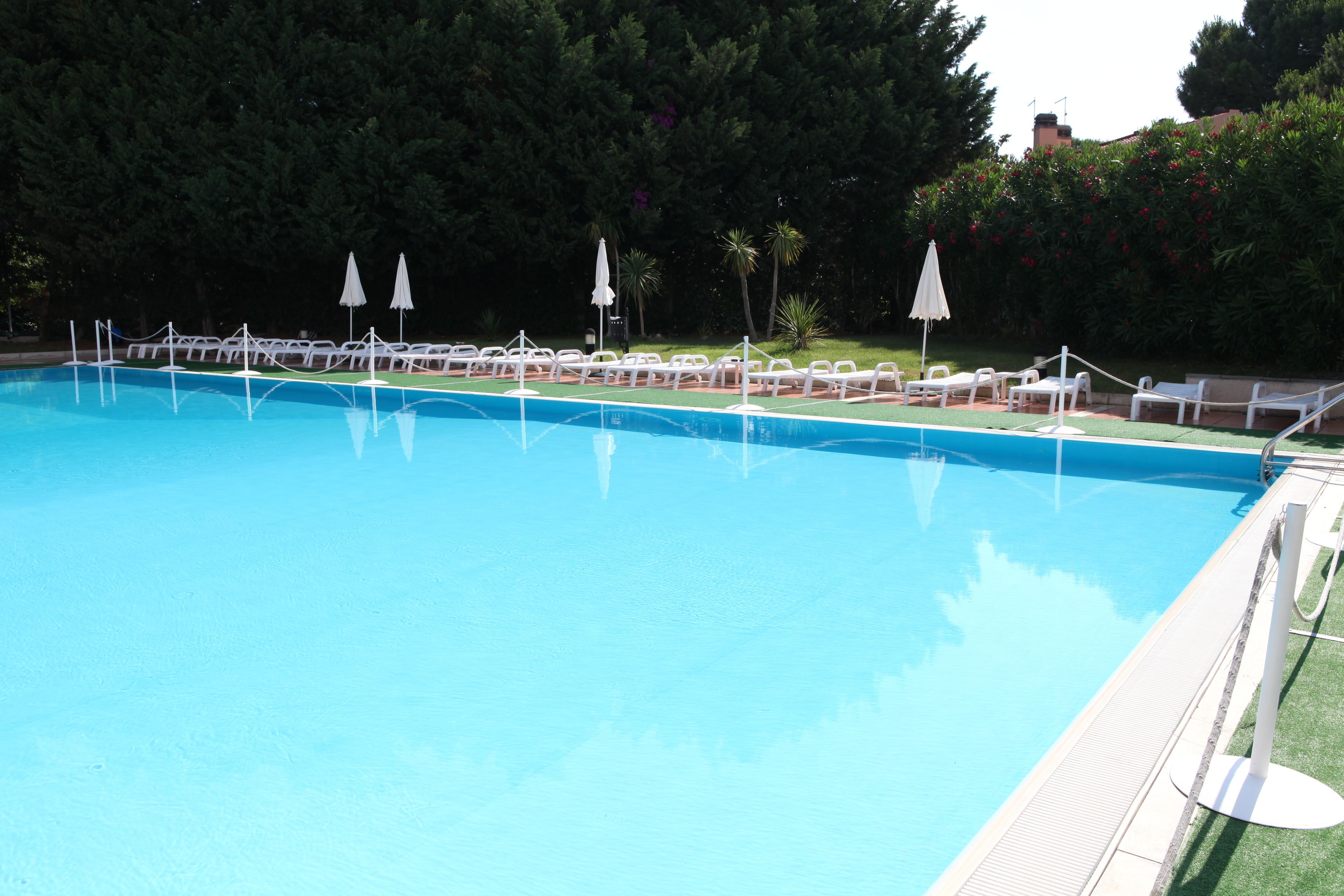 Seasonal outdoor pool, open 9:00 AM to 7:30 PM, pool umbrellas