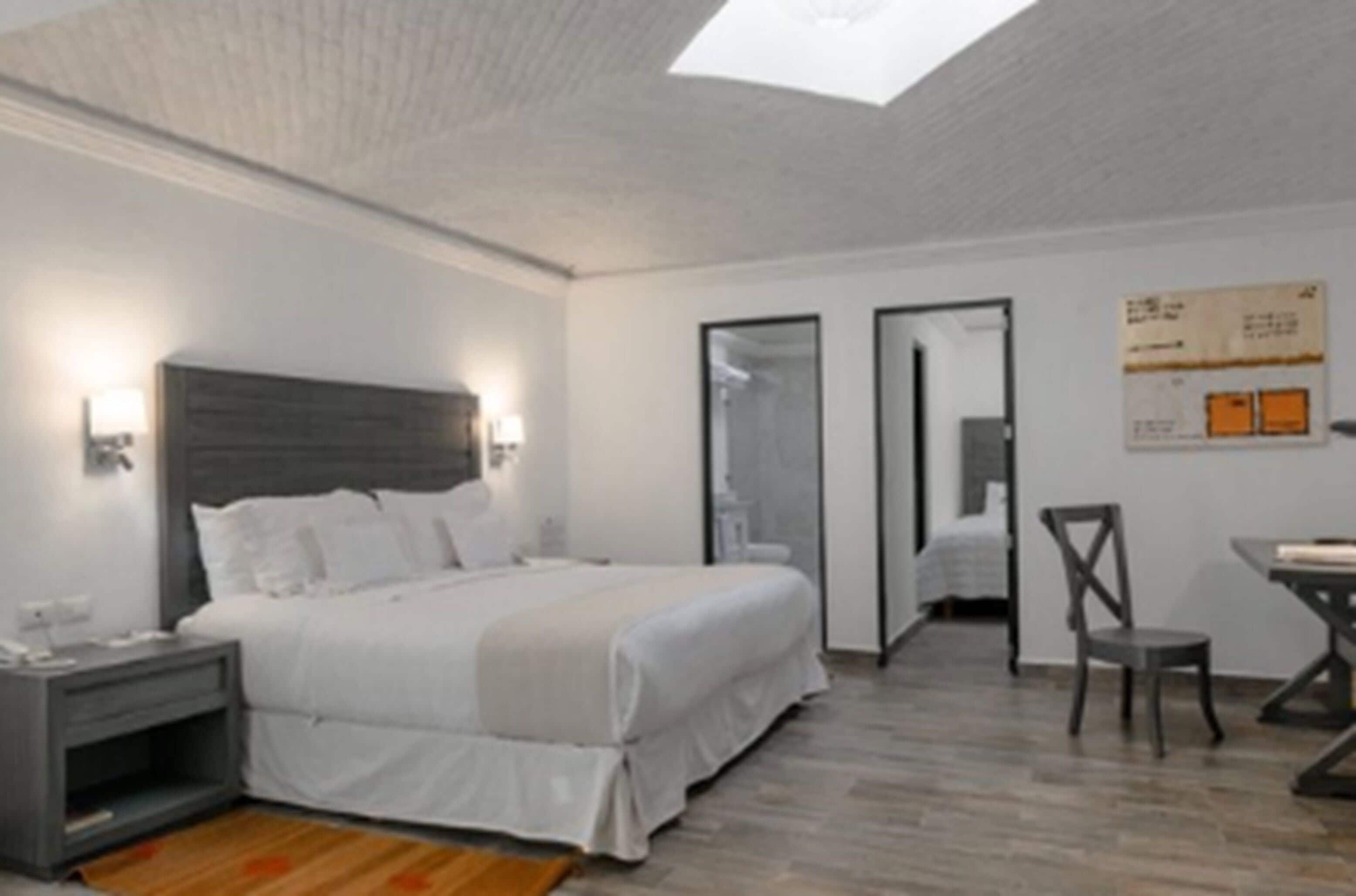 family room | 1 bedroom, premium bedding, free minibar items, in-room safe