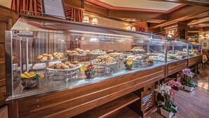 A buffet with various food items and a sign indicating the brand 'TECFRIGO'.