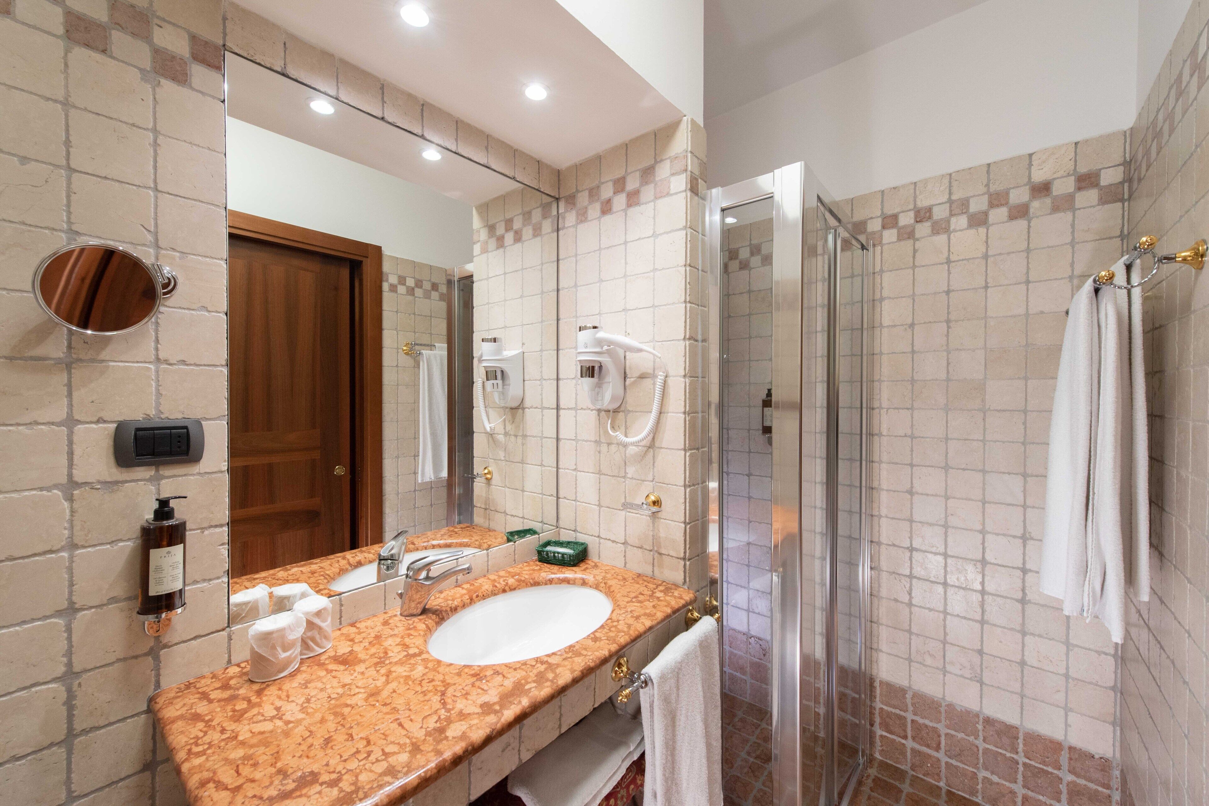 shower, bidet, towels, toilet paper