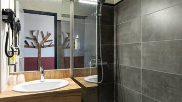Bathtub, eco-friendly toiletries, hair dryer, towels