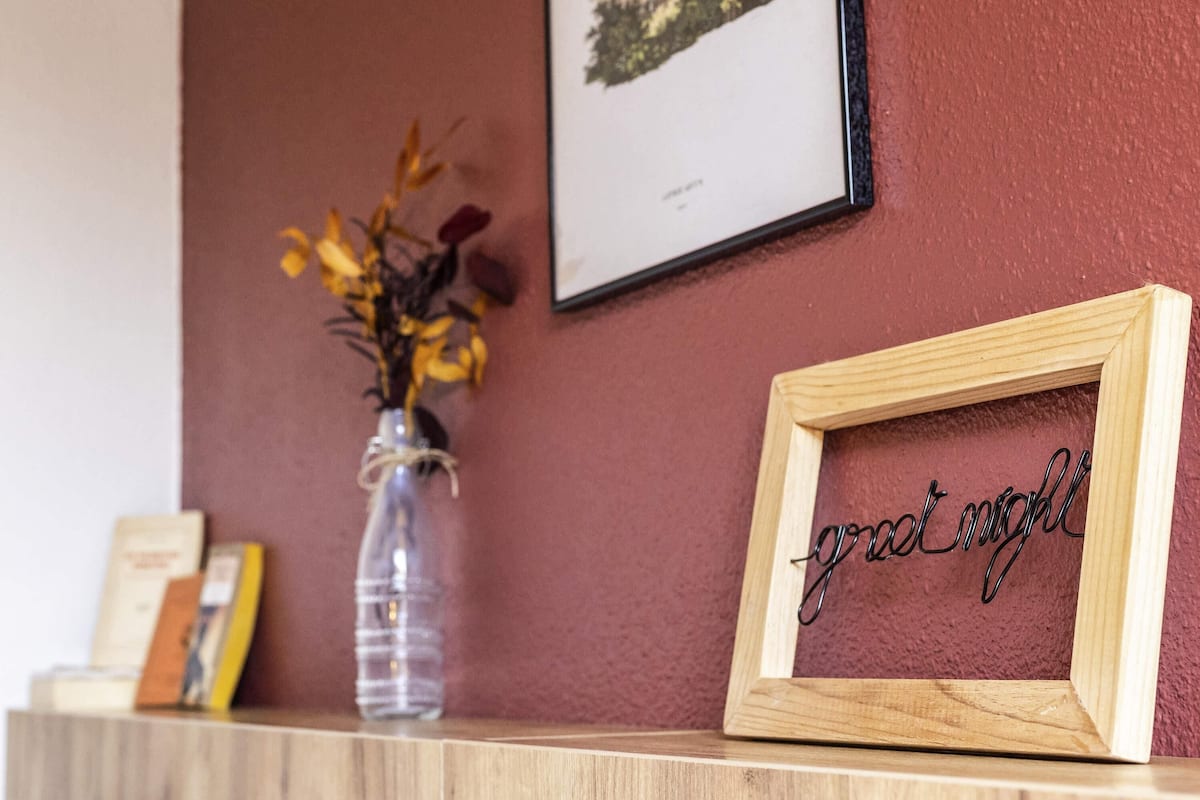 A wooden frame with the word "goodnight" on a wall.