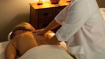 Experience a serene massage therapy session in a peaceful room designed for relaxation.