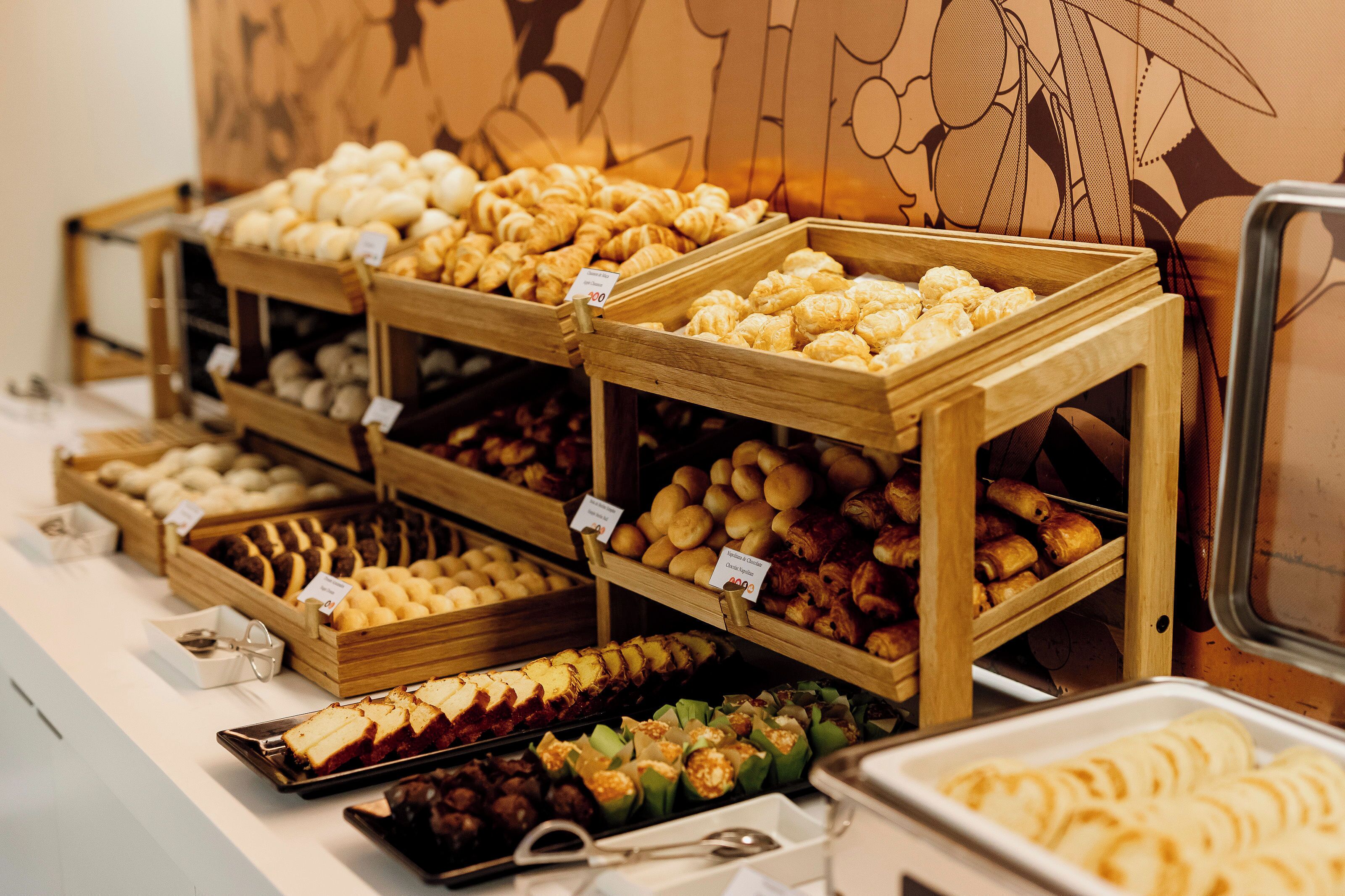 A bakery display with various pastries and baked goods.